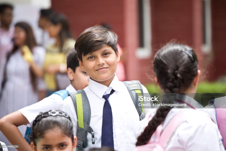 Group of Indian schoolboys and schoolgirls at school campus